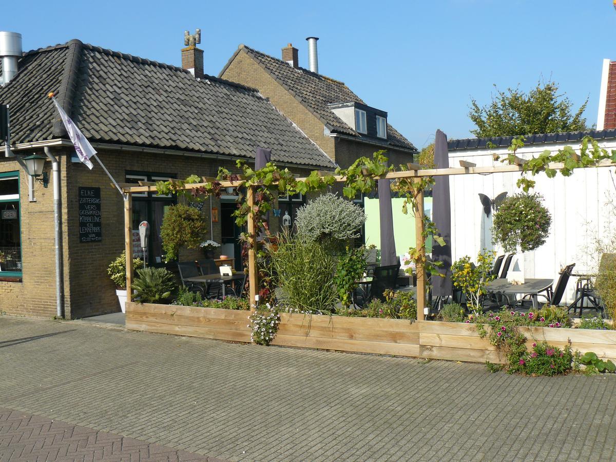 Eetcafe/Pension Nooitgedacht Strijen Extérieur photo